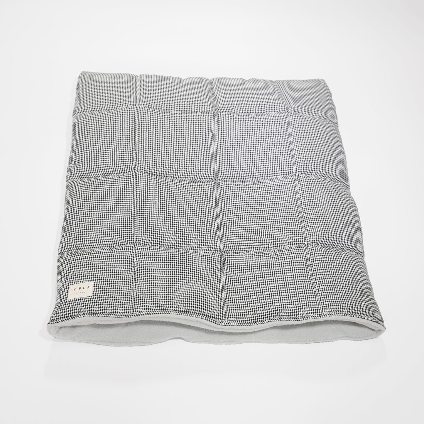 Top view of quilted luxury dog travel plush dog snuggle bed by LE PUP.