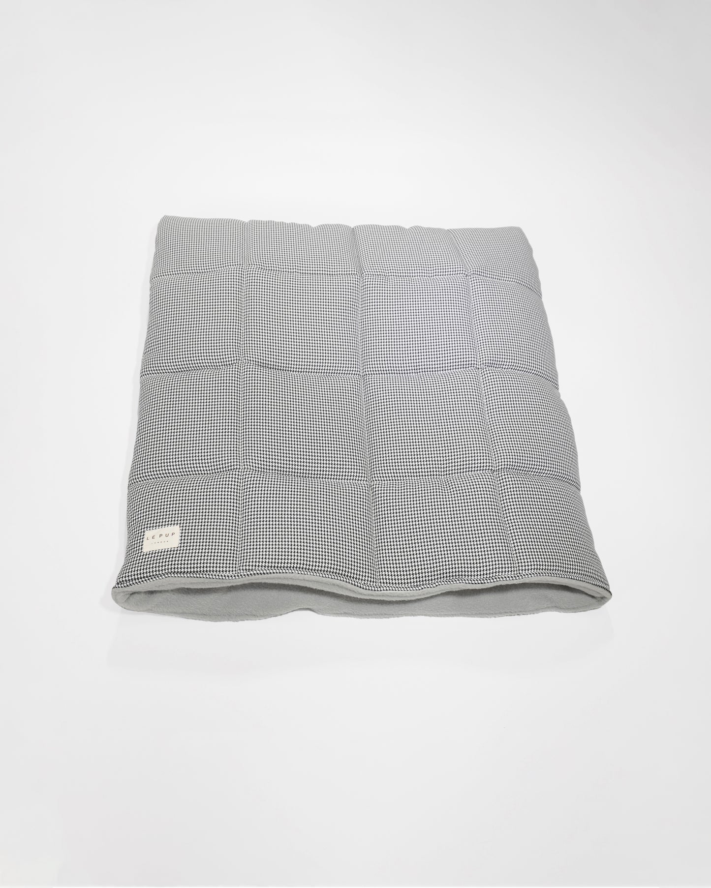 Top view of quilted luxury dog travel plush dog snuggle bed by LE PUP.