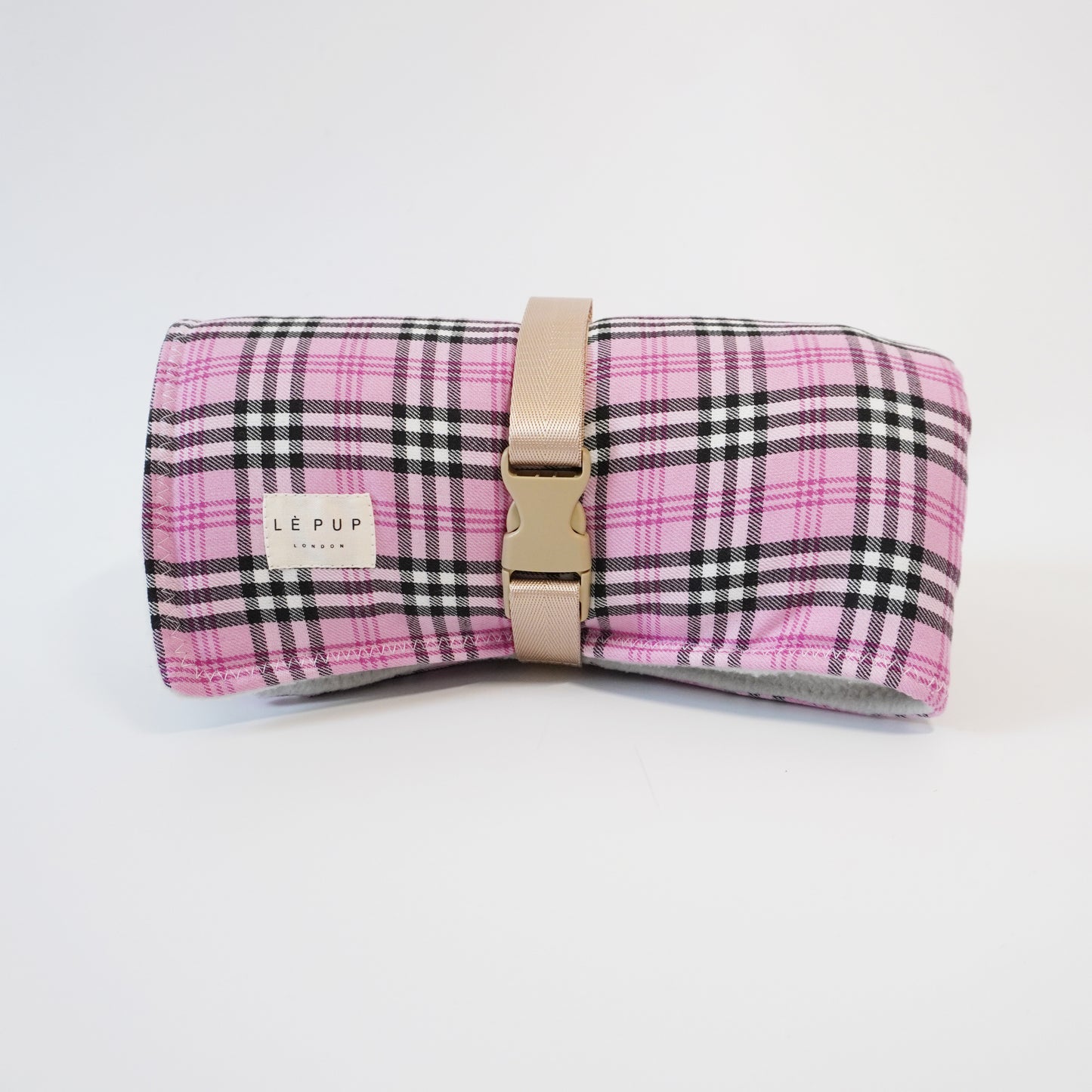 Front view of Pink tartan gingham rolled up travel dog mat for car by LE PUP.