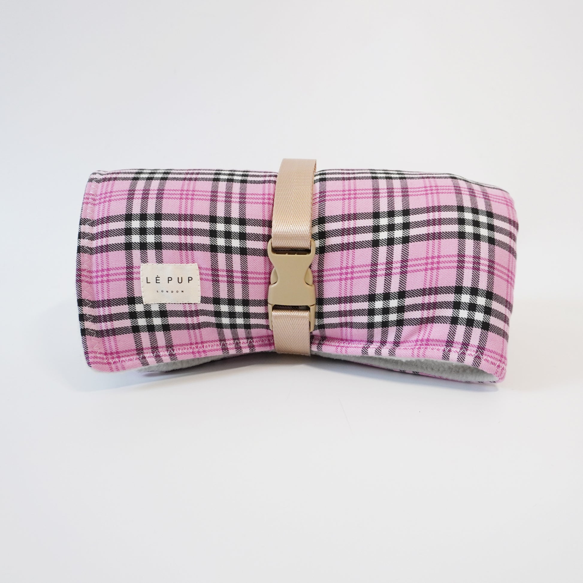 Front view of Pink tartan gingham rolled up travel dog mat for car by LE PUP.