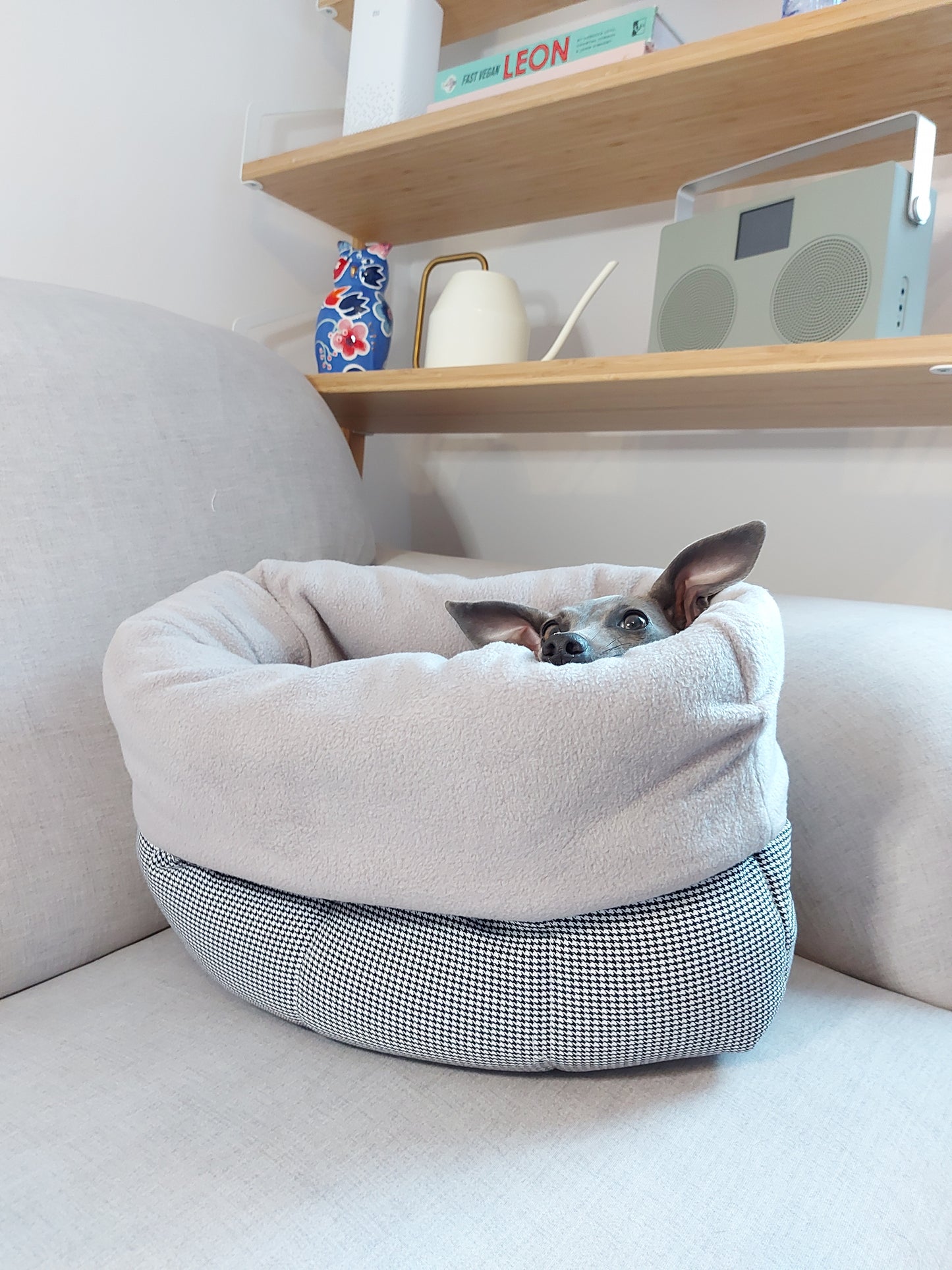 Happy dog cosy and snuggling in her LÈ PUP nesting bed for dogs by LE PUP.