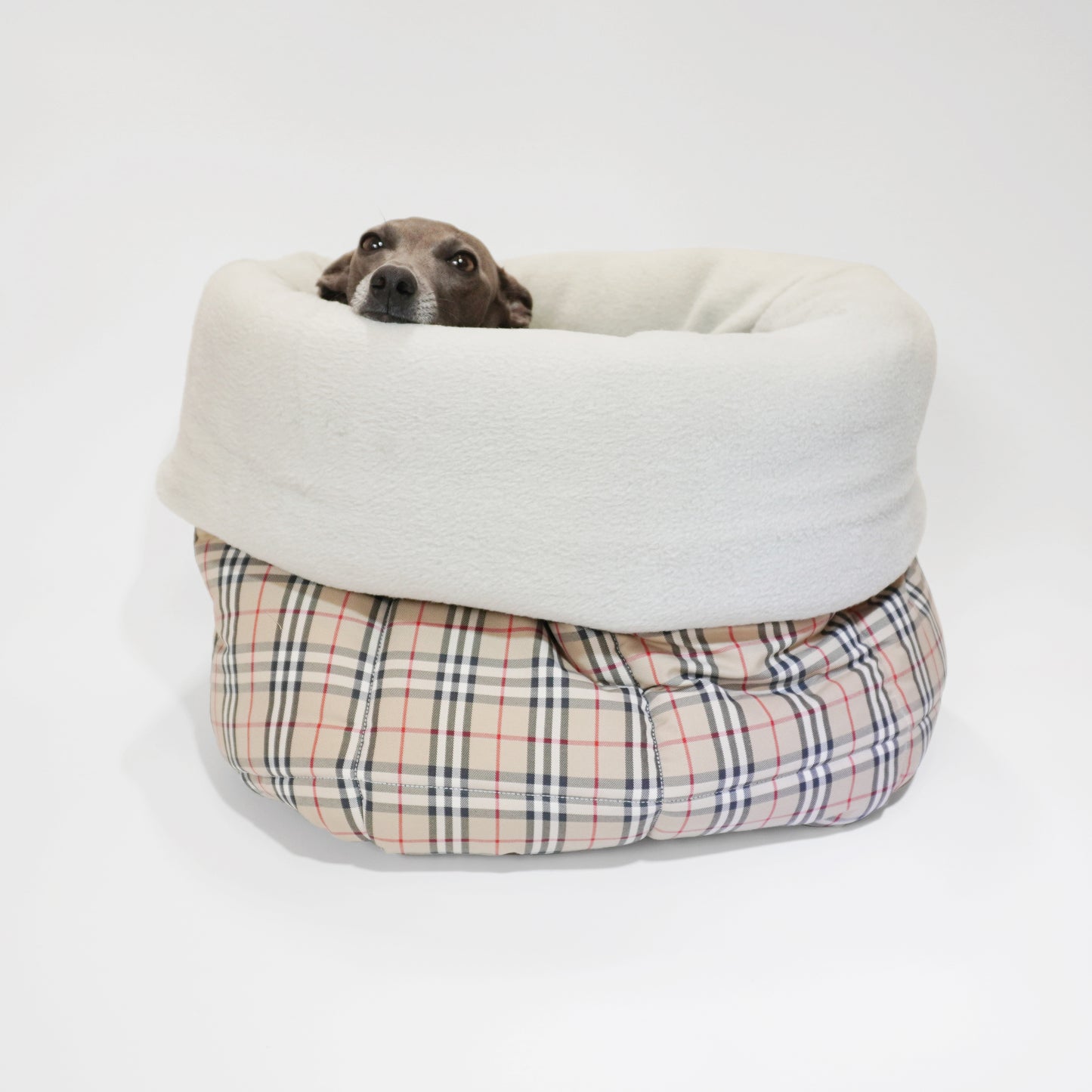 Italian greyhound sleeping inside luxury dog snuggle sac with folded sides in tartan by LE PUP.