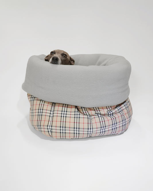 Cute Italian greyhound peeping from portable dog snuggle sack in tartan fabric, perfect as a dog car bed by LE PUP.