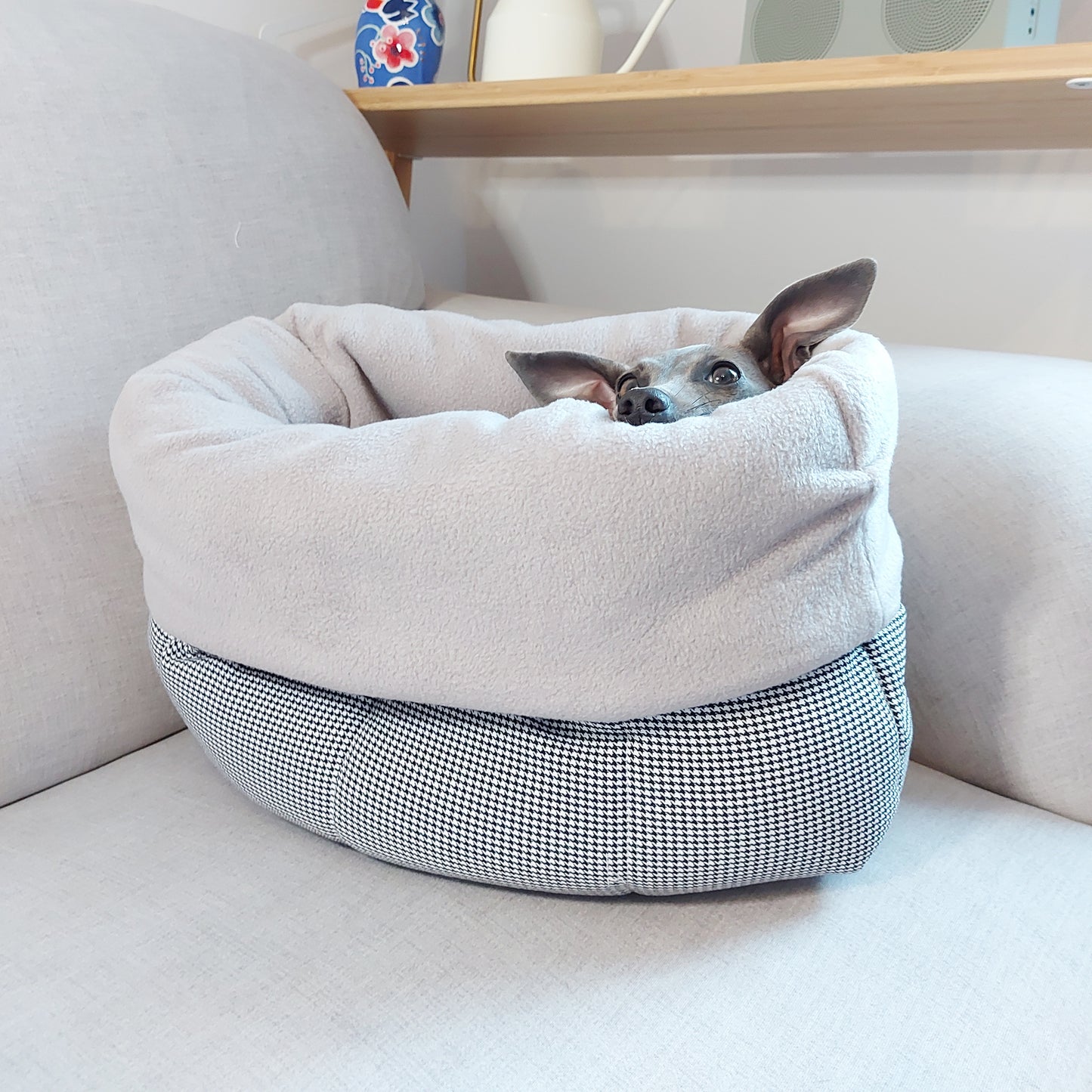 Happy dog cosy and snuggling in her LÈ PUP nesting bed for dogs by LE PUP.