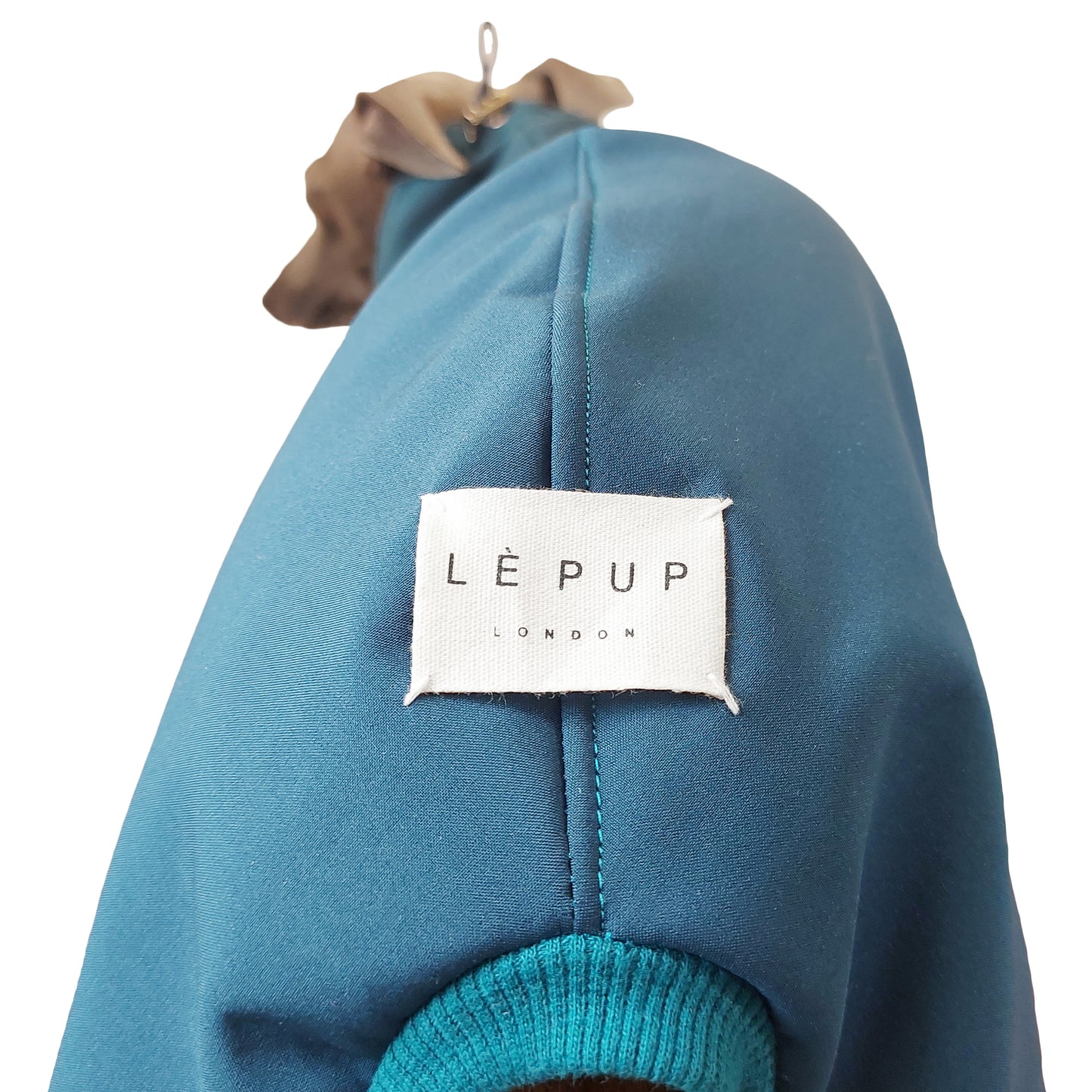 Close up of custom made teal waterproof softshell dog raincoat by LE PUP.